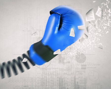Boxing glove on spring as suddenness conceptの写真素材