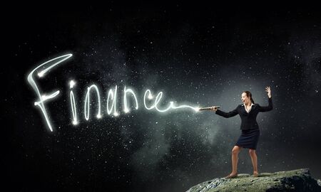 Woman drawing with lantern light business conceptual wordsの写真素材
