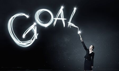 Woman drawing with lantern light business conceptual wordsの写真素材