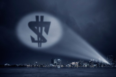 Money conceptual image with dollar sign in spotlightの写真素材