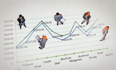 Top view of business people and graphs and diagrams on floor