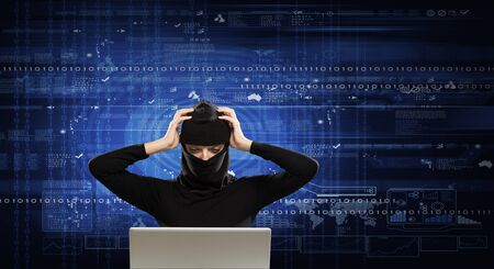 Hacker woman in dark clothes using laptop against digital background