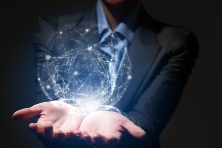 Hand of business person presenting in palms digital connection conceptの写真素材