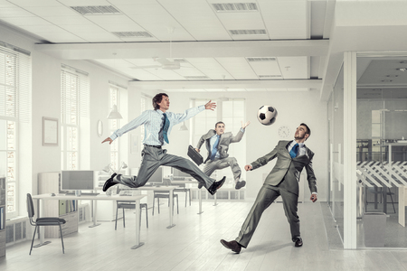Business people in suit in modern office play ballの写真素材