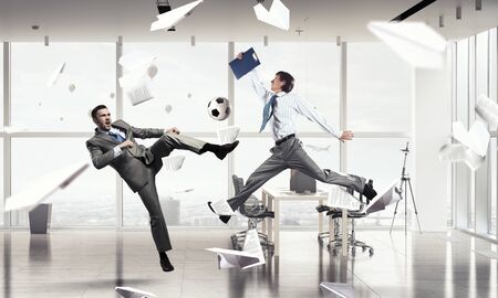 Business people in suit in modern office play ballの写真素材