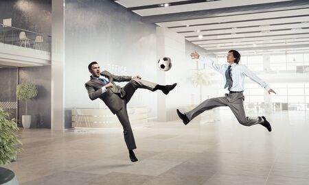 Business people in suit in modern office play ballの写真素材