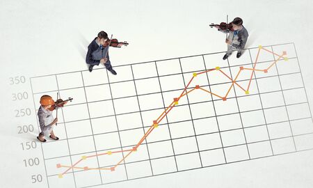 Top view of business people and graphs and diagrams on floor