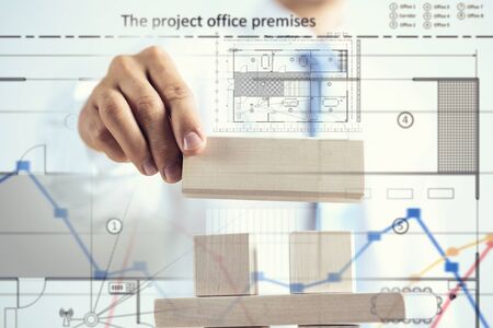 Close view of businessman making pyramid with empty wooden cubesの写真素材