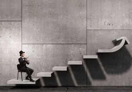 Businessman taking break and having cup of hot aromatic coffeeの写真素材