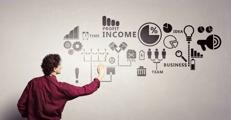 Young handsome man painter with brush in handの写真素材