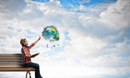 Hipster guy with book in hands. Elements of this image are furnished by NASA