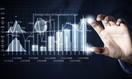 Close view of businesswoman touching with finger on screen market infographs