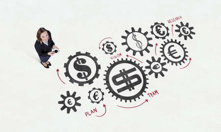 Top view of businesswoman and graphs and diagrams on floor