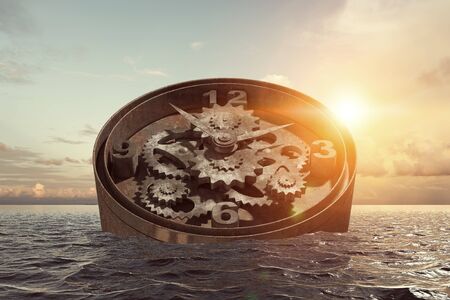 Time concept with clock mechanism drowning in water