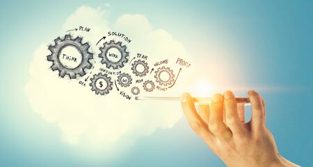 Smartphone in hand and cloud computing user interfaceの写真素材