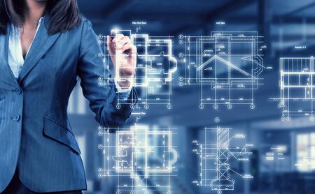 Chest view of businesswoman drawing infographs on screenの写真素材