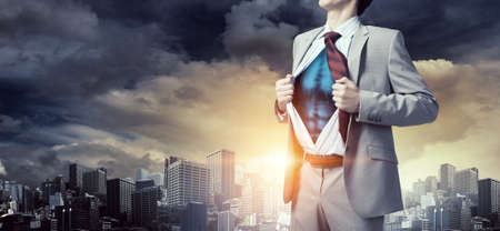 Office worker opening his shirt on chest like superheroの写真素材