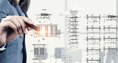 Female architect working with virtual construction planの写真素材