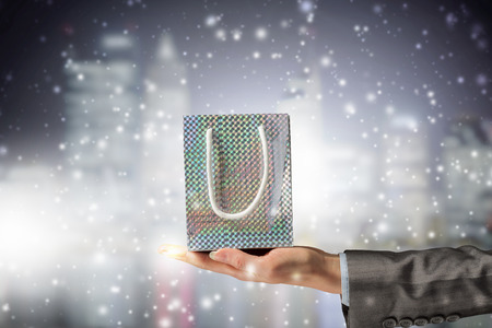 Close view of businesswoman hand holding gift boxの写真素材