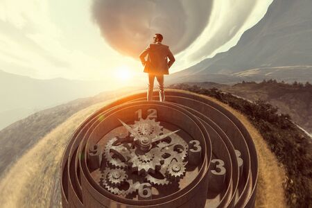 Businessman standing on old clock mechanism against sky backgroundの写真素材