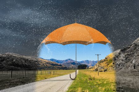 Conceptual image with color umbrella in sky under rain