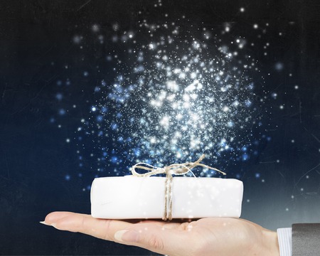 Close view of businesswoman hand holding gift box