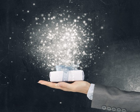 Close view of businesswoman hand holding gift box