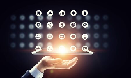 Hand of businessman holding touchpad pc presenting social network conceptの写真素材