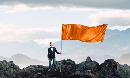 Young student guy with color blank waving flagの写真素材