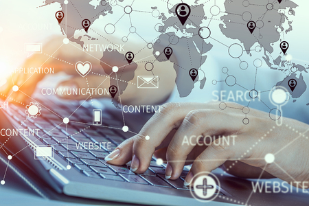 Close up of female hands working on computer keyboardの写真素材