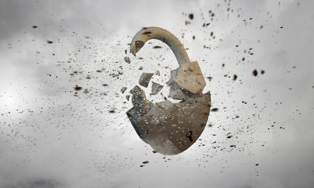 Conceptual image with stone broken lock as security conceptの写真素材