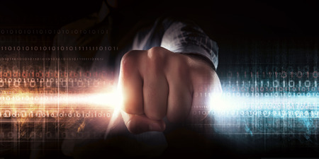 Close up of businessman grasping light in fist