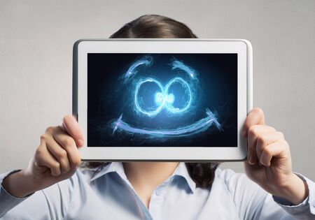 Confident young businesswoman working on digital tablet pcの写真素材