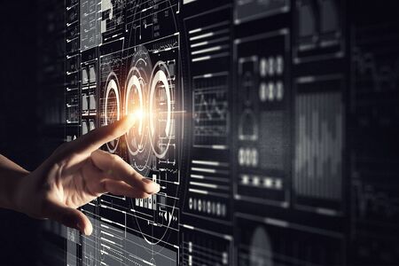 Businesswoman hand touching with finger virtual panel with infographs