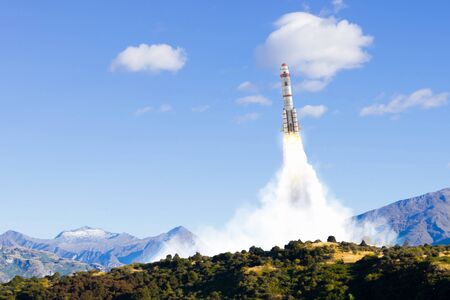 Military missile flying high in blue skyの写真素材