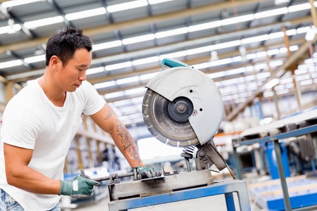 portrait of asian worker in production plant working on the factory floorの写真素材
