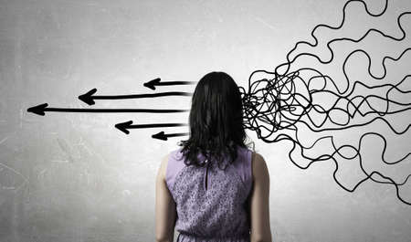 Pretty young woman making decision with arrows coming out of her head