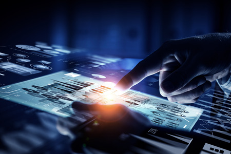 Hand of businessman touching with finger media screen