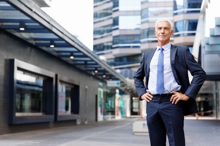 Portrait of confident businessman in suit outdoorsの写真素材