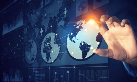 Close up of businessman touching virtual panel with finger
