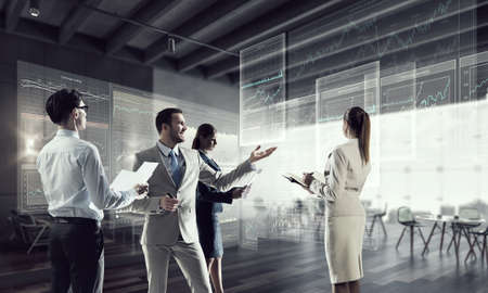 Business people in modern office interior working in cooperationの写真素材