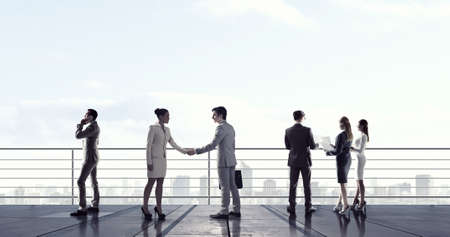 Outdoor business meeting on roof of buildingの写真素材