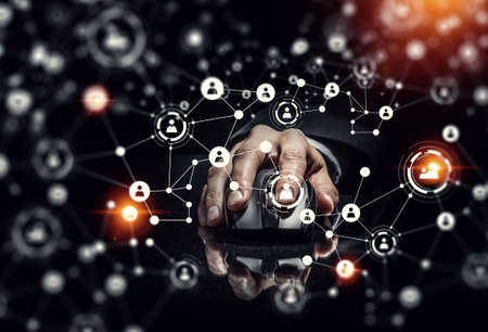 Hand of businessman on dark 3D rendering background using wireless mouse