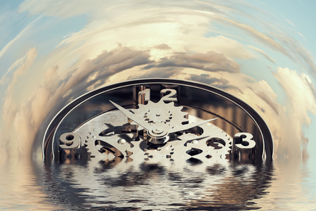 Time concept with clock mechanism drowning in waterの写真素材