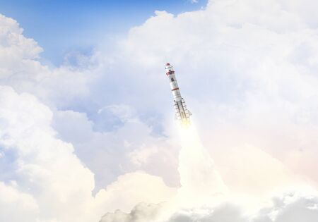 Military missile flying high in blue sky