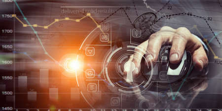 Hand of businessman on dark 3D rendering background using wireless mouseの写真素材