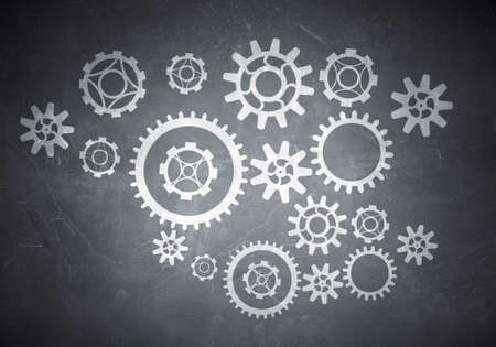 Gears mechanism as teamwork concept on wall background