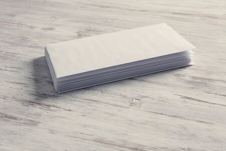 Blank white cards on wooden vintage tableの写真素材