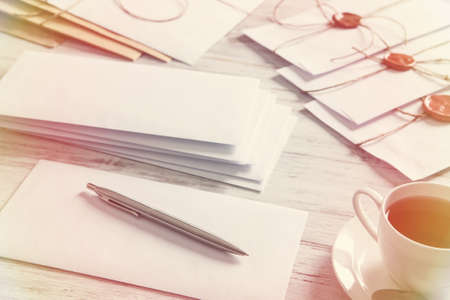 Old post concept with envelope with wax seal on wooden surface