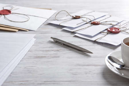 Old post concept with envelope with wax seal on wooden surfaceの写真素材